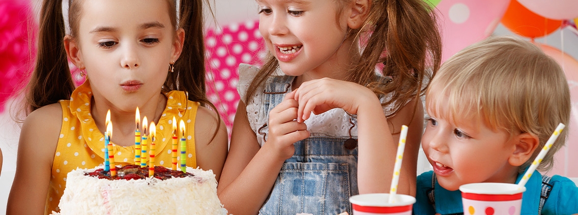 blowing out candles in a private party room at Mt Playmore
