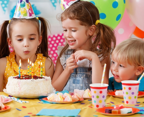 blowing out candles in a private party room at Mt Playmore